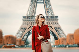 girl in red coat and bag at parisian street