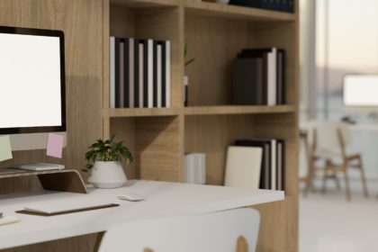 side view, Minimal and comfortable office workspace with computer mockup, wooden shelves